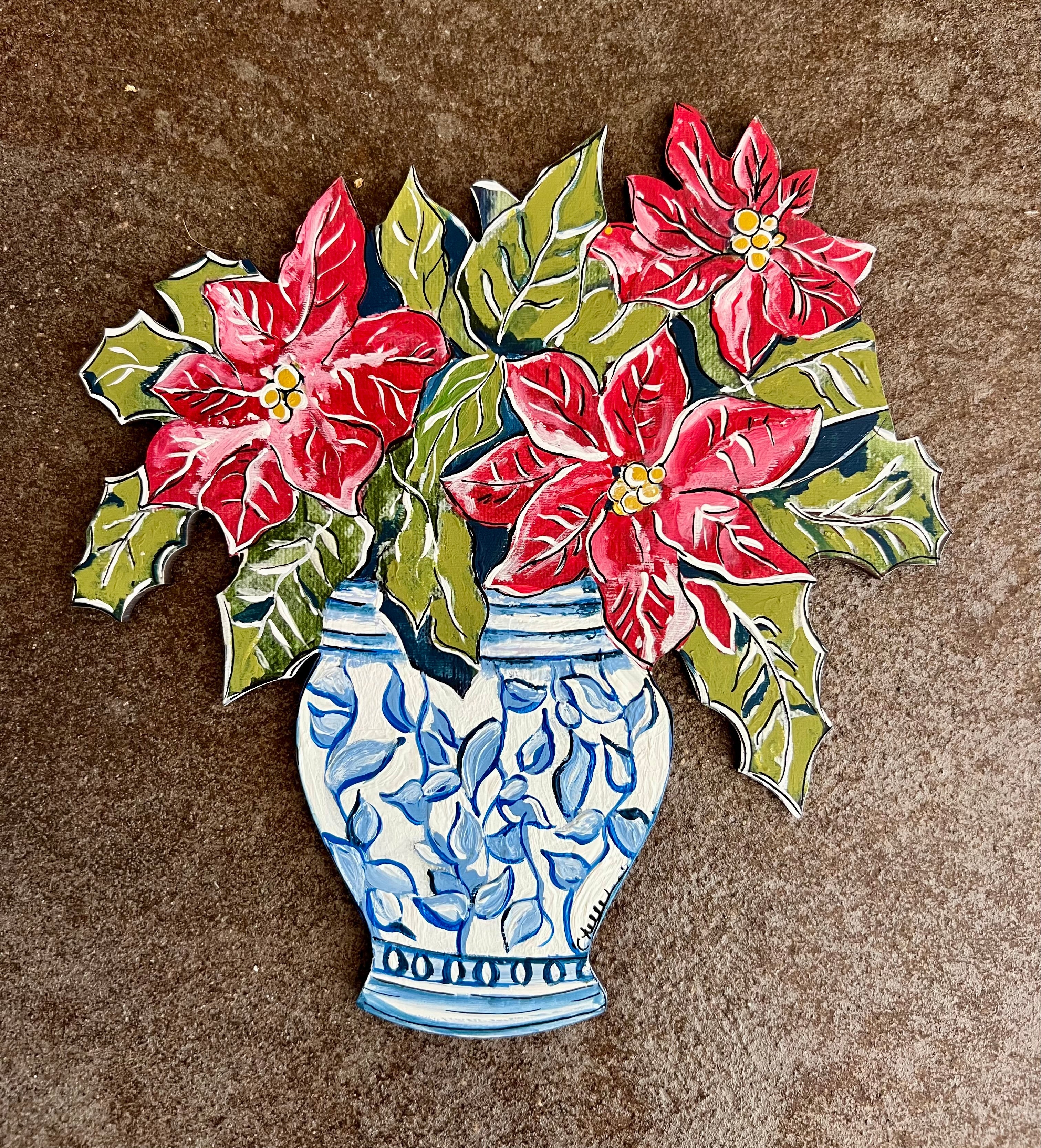 THE HAPPY BUTTERFLY POINSETTIA'S IN BLUE VASE